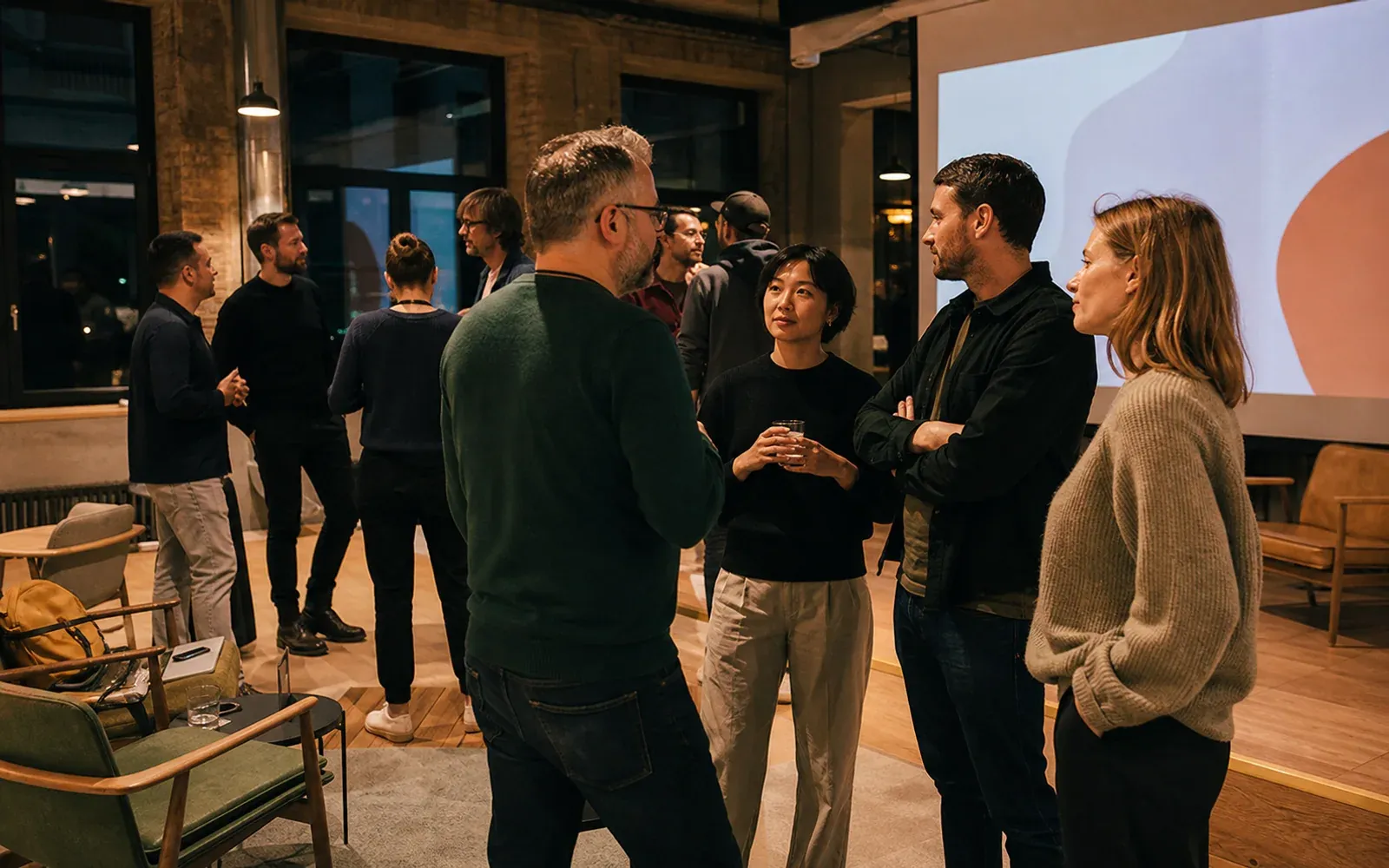Founders and technology professionals talking at a small Kaunas meetup
